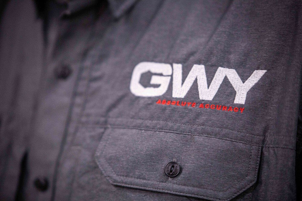 The GWY logo on a gray shirt of a company technician